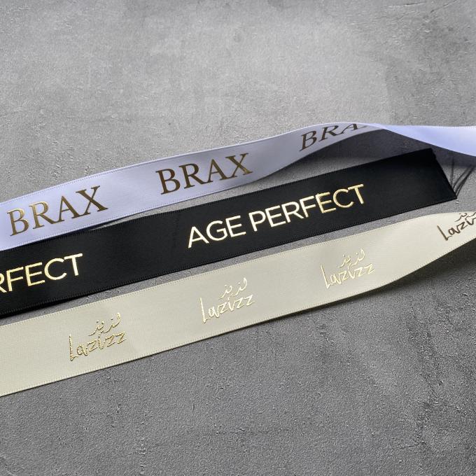 Lo spostamento di regalo di lusso ha personalizzato la stagnola di oro 3D impressa stampata con Logo Custom Satin Ribbon 1